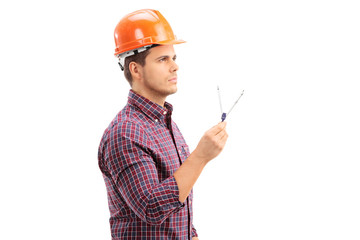 Male architect holding a drawing compass