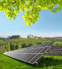 Solar energy panels in spring landscape