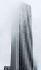 Fototapeta premium Tall Building Into Fog