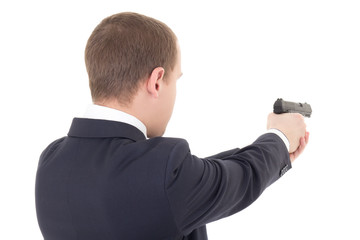 back view of man shooting with gun isolated on white