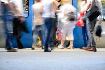 Passengers about to enter train, motion blur