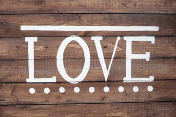 Word LOVE on a wooden background