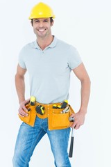 Happy worker holding hammer over white background