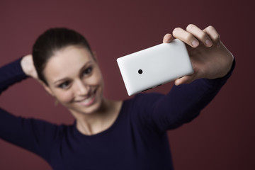 Smiling woman taking a selfie