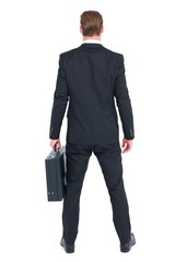 Rear view businessman standing with his briefcase