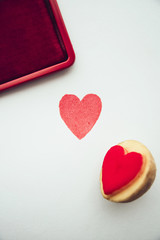 Fototapeta premium Objects: Heart shaped potato stamp on white paper