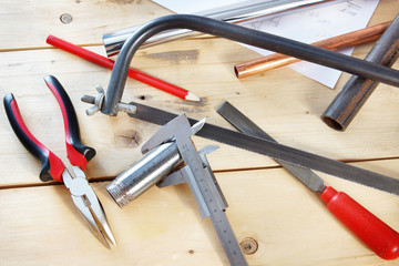 Metalwork tools lie on the workbench