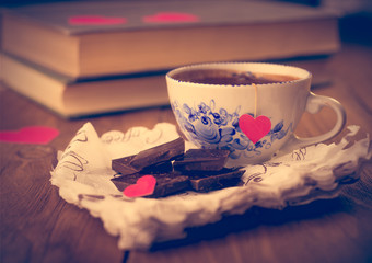 Coffee and chocolate, in the background of the heart from the ca