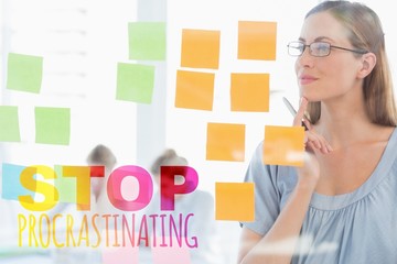 Concentrated artist looking at colorful sticky notes