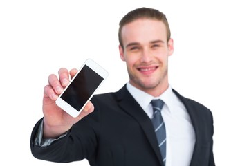 Smiling businessman showing his smartphone screen