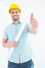 Male architect with blueprint gesturing thumbs up