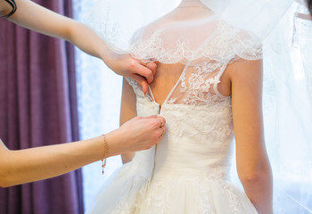 fastening detail of the dress from the bride