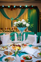 Arrangement of flowers at the wedding table