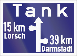 Old design (1938) of a highway direction sign with note of a Gas Station (Tank)