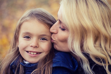 Mom daughter autumn walk