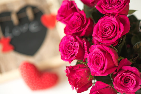 decoration with pink roses, heart, love sign with the inscriptio