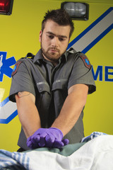 Paramedic who make a cardio-pulmonary resuscitation to a person