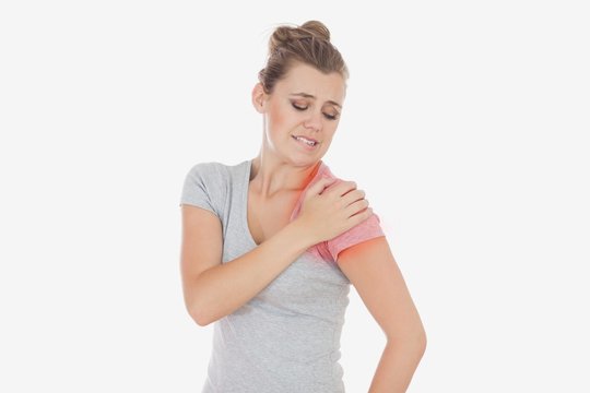 Woman suffering from shoulder pain