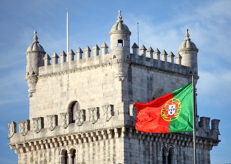  Belem Tower in Lisbon and Portuguese national flag  - 77375693