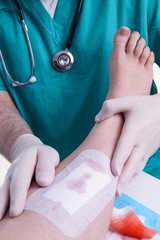 Doctor patches the Injury