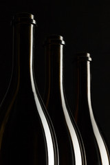 Silhouettes of elegant wine bottles