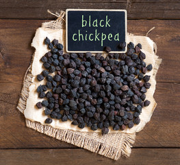 Black Chickpea with a small chalkboard