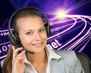 Closeup of businesswoman in headset, wire-frame building with