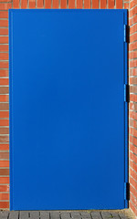 steel blue door brick house
