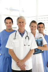 Medical team standing in a row with senior leader