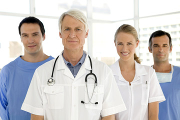 Medical team standing in a row with senior leader