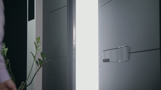 Opening the door of an apartment