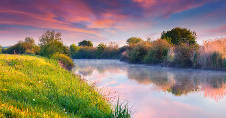 Colorful summer sunrise on the river