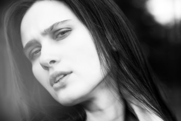 Sad girl looking in camera black and white