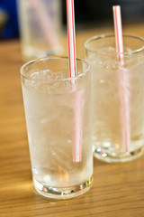 glass of water placed on a wooden table
