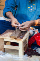 man demonatrate to make a handcraft