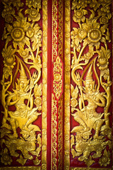 Golden buddhist temple wall in Thailand