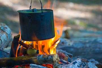 tuoristic cauldron on a fire