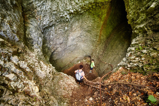 Family Of Hikers In A Cave