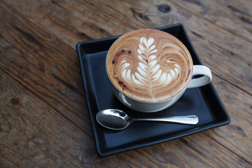 A cup of coffee mocha on wooden