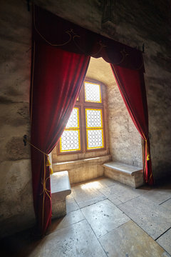 Castle window with curtains