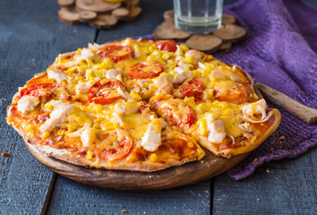 juicy slices of pizza with chicken, corn, tomatoes and double ch