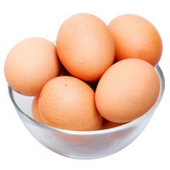 Brown eggs in glass bowl