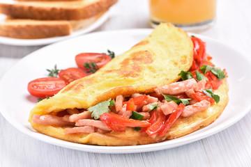 Egg omelette with vegetables and ham