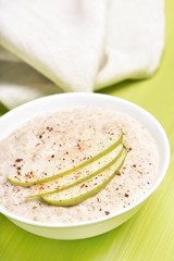 Oatmeal porridge with apples and cinnamon