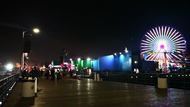 A view of the attractions of the Santa Monica Pier at night