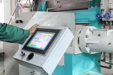 man operating factory machinery