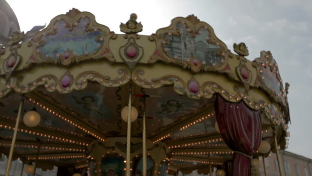 TRIESTE, ITALY - SEP 15, 2013: Close shot of the motley and picturesque top of merry-go-round