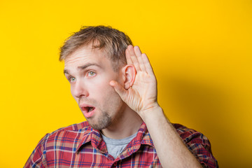 young man eavesdropping