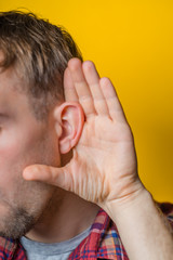 young man eavesdropping