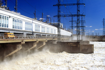 Fototapeta premium Hydroelectric dam during the spring discharge